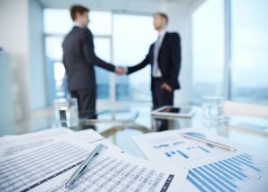 two men shaking hands business meeting